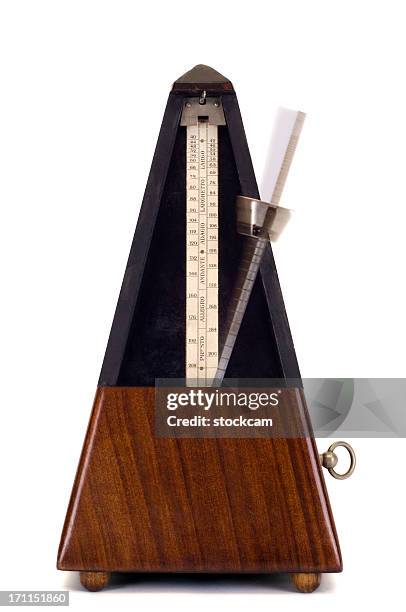 running metronome on white - metronom stock pictures, royalty-free photos & images