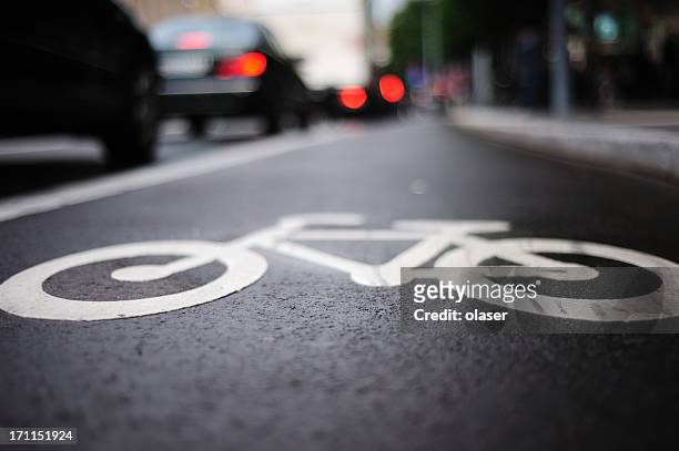 bike lane and traffic - bicycle lane stock pictures, royalty-free photos & images