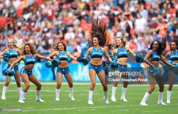 Jacksonville Jaguars cheerleaders are seen on the field prior to the NFL match between Atlanta Falcons and Jacksonville Jaguars at Wembley Stadium on...