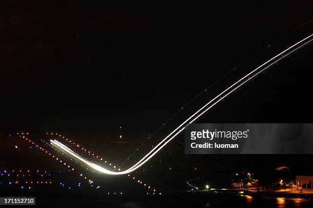 airplane during takeoff - airport lights stock pictures, royalty-free photos & images