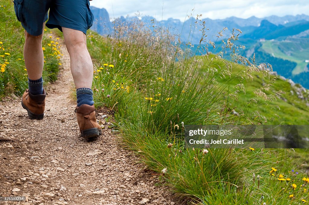 Hiking legs in mountains of northern Italy near Val Gardena