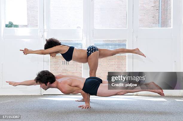 Balancing Stick And One Armed Peacock Yoga Pose High-Res Stock Photo -  Getty Images