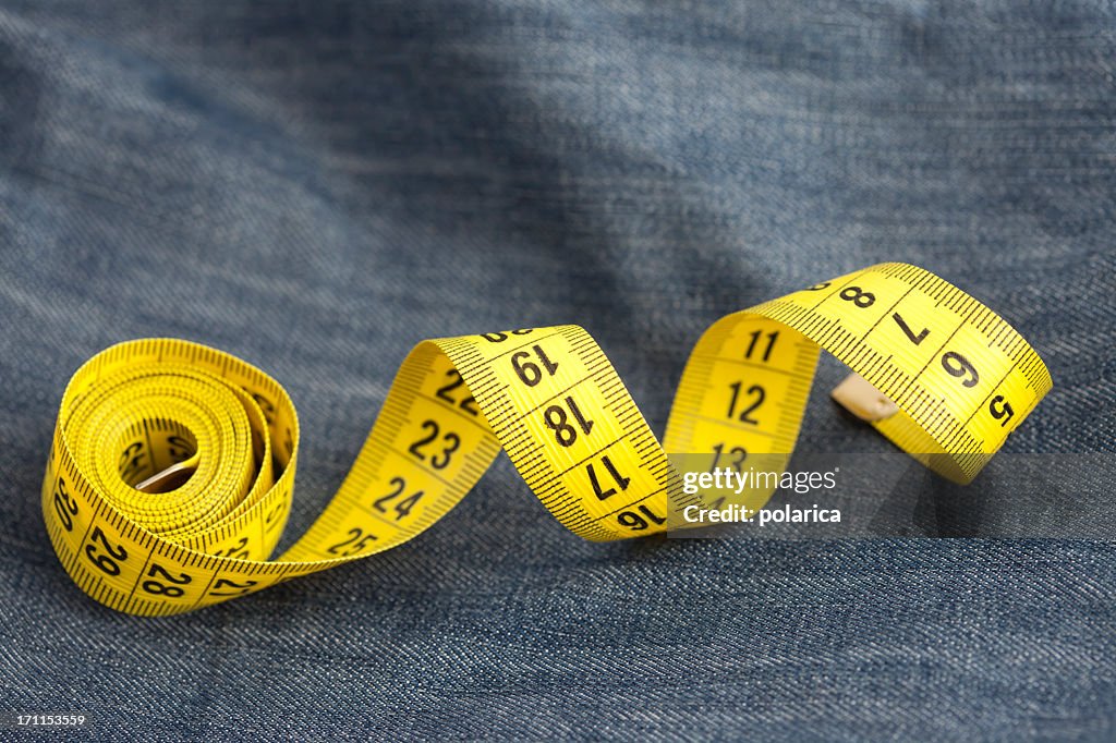 Measure tape on jeans