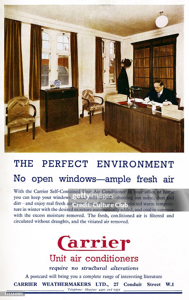 Air conditioning in the workplace - man seated at his desk in the office.