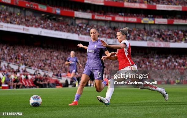 Mia Enderby of Liverpool Women competing with Steph Catley of Arsenal Women during the Barclays Women's Super League match between Arsenal FC and...