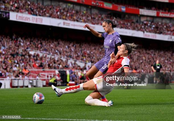 Mia Enderby of Liverpool Women competing with Steph Catley of Arsenal Women during the Barclays Women's Super League match between Arsenal FC and...
