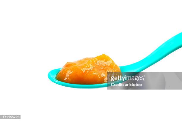 baby food: pureed pumpkin on a spoon - pure white background bildbanksfoton och bilder