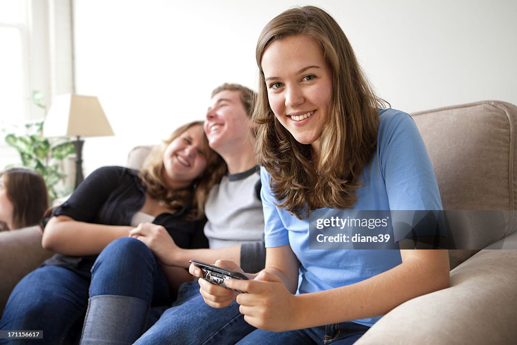 Teenage girl texting on a mobile device