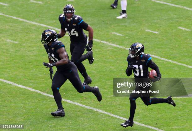 Darious Williams of the Jacksonville Jaguars scores a 61 yard touchdown after an interception thrown by Desmond Ridder of the Atlanta Falcons during...