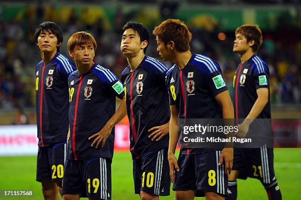 Hideto Takahashi, Takashi Inui, Shinji Kagawa, Hiroshi Kiyotake and Hiroki Sakai of Japan look on after losing to Mexico by a score of 2-1 during the...