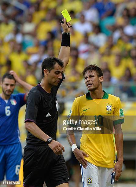 Neymar of Brazil is booked by Referee Ravshan Irmatov during the FIFA Confederations Cup Brazil 2013 Group A match between Italy and Brazil at...