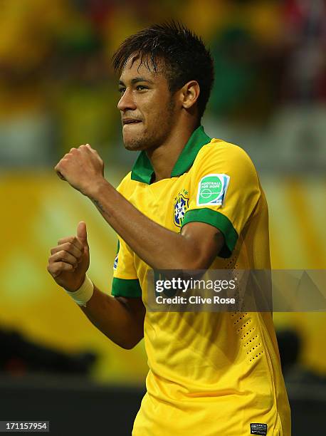 Neymar of Brazil celebrates as he scores their second goal from a free kick during the FIFA Confederations Cup Brazil 2013 Group A match between...