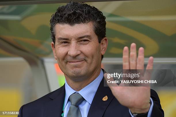 Mexico's coach Jose Manuel de la Torre waves before the start of the FIFA Confederations Cup Brazil 2013 Group A football match against Japan, at the...