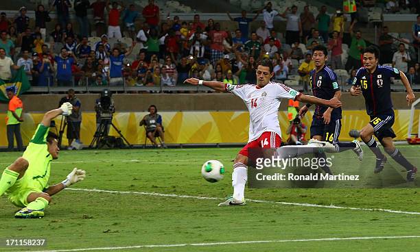 Javier Hernandez of Mexico attempts a shot on the rebound of his penalty kick against Eiji Kawashima of Japan makes during the FIFA Confederations...