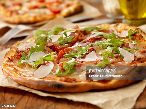 pizza with ham - arugula stock pictures, royalty-free photos & images