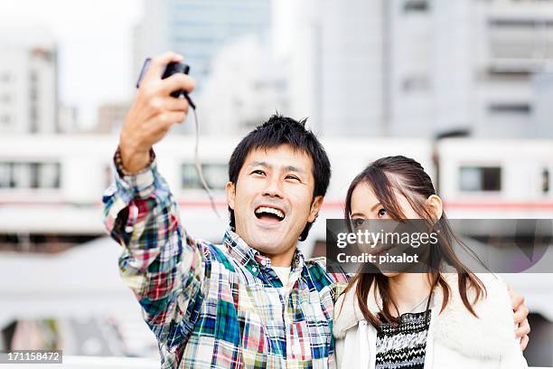 couple taking portraits of themselves - only japanese stock pictures, royalty-free photos & images