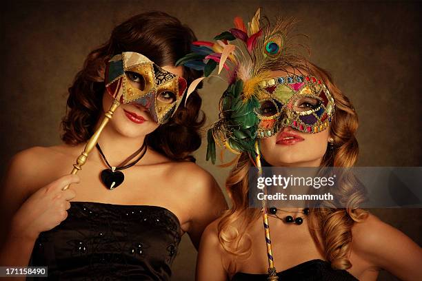 girls with venetian mask - fiesta posterior stock pictures, royalty-free photos & images