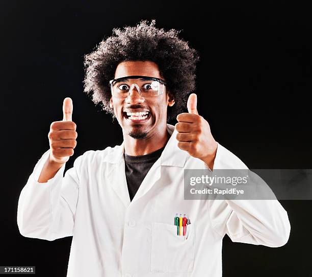 eccentric scientist gives two approving thumbs up and grins - stralende glimlach stockfoto's en -beelden