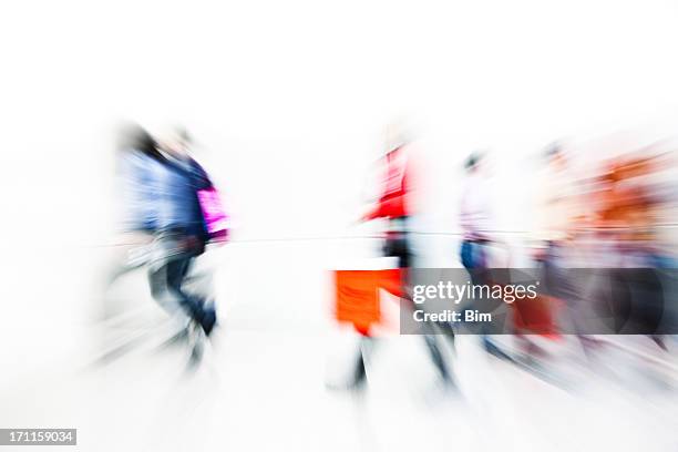 abstract image of shoppers with shopping bags, motion blur - shopping abstract stockfoto's en -beelden