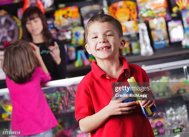 happy little boy with prizes - arcade stockfoto's en -beelden