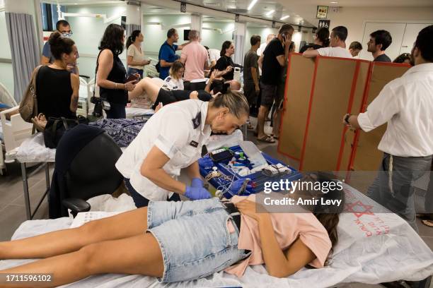 Israelis donate blood in Tel Aviv's Sourasky Medical Center after officials call for people to donate blood on October 7, 2023 in Tel Aviv, Israel....