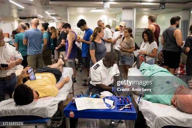 Israelis donate blood in Tel Aviv's Sourasky Medical Center after officials call for people to donate blood on October 7, 2023 in Tel Aviv, Israel....