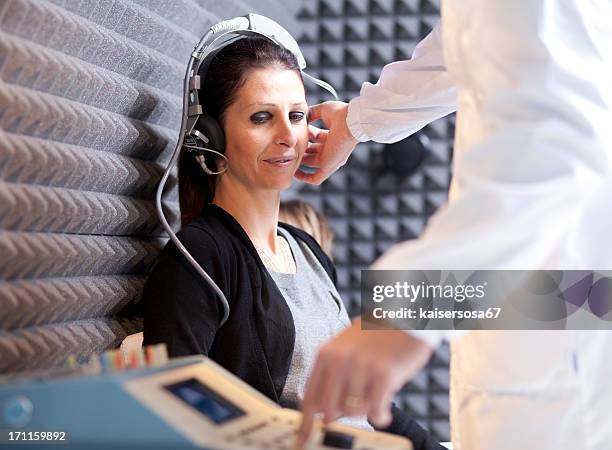 hearing test - ear exam stock pictures, royalty-free photos & images