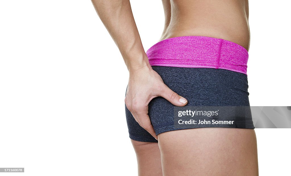 Female buttocks wearing workout clothing