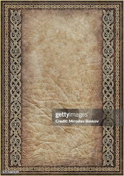 hi-res antique parchment with medieval gilded arabesque linear decorative motif - middeleeuws stockfoto's en -beelden