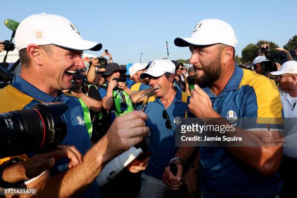 Justin Rose, Rory McIlroy and Jon Rahm of Team Europe celebrate victory on the 18th green during the Sunday singles matches of the 2023 Ryder Cup at...