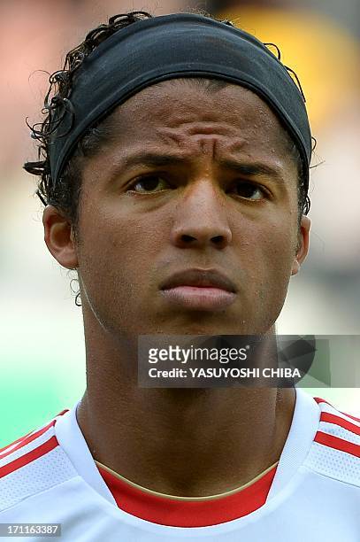 Mexico's midfielder Giovani Dos Santos listens to the national anthems before the start of the FIFA Confederations Cup Brazil 2013 Group A football...