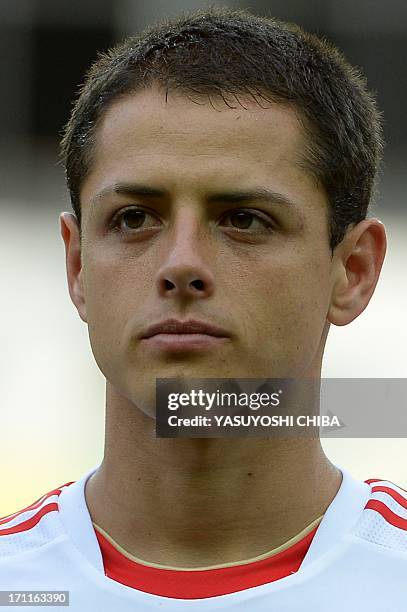 Mexico's forward Javier Hernandez listens to the national anthems before the start of the FIFA Confederations Cup Brazil 2013 Group A football match...