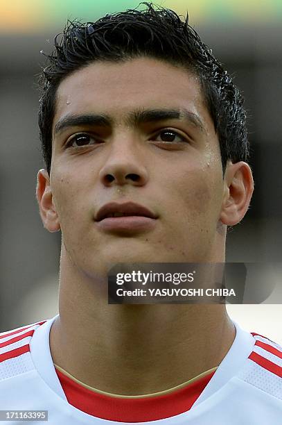 Mexico's forward Raul Jimenez listens to the national anthems before the start of the FIFA Confederations Cup Brazil 2013 Group A football match...