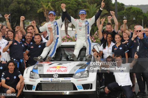 Sebastien Ogier of France and Julien Ingrassia of France celebrate their victory during Day Two of the WRC Italy on June 22, 2013 in Olbia, Italy.