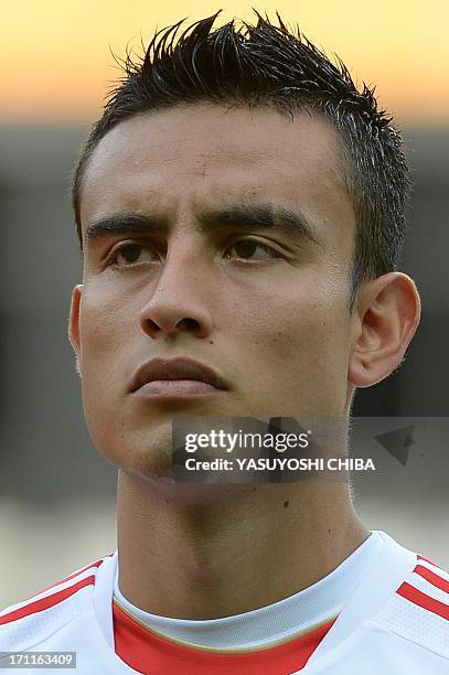 Mexico's defender Jesus Zavala listens to the national anthems before the start of the FIFA Confederations Cup Brazil 2013 Group A football match...