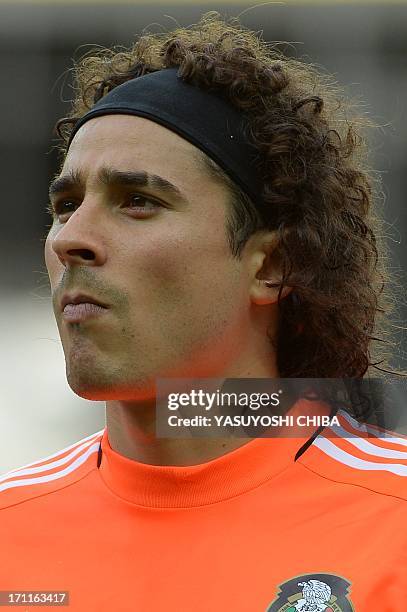 Mexico's goalkeeper Guillermo Ochoa listens to the national anthems before the start of the FIFA Confederations Cup Brazil 2013 Group A football...