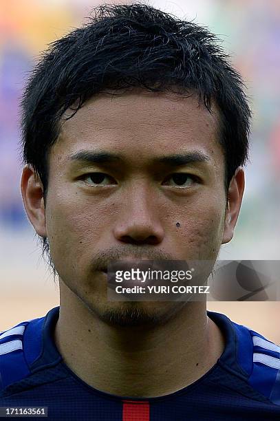 Japan's defender Yuto Nagatomo listens to the national anthems before the start of the FIFA Confederations Cup Brazil 2013 Group A football match...