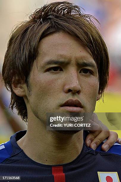 Japan's midfielder Hajime Hosagai listens to the national anthems before the start of the FIFA Confederations Cup Brazil 2013 Group A football match...