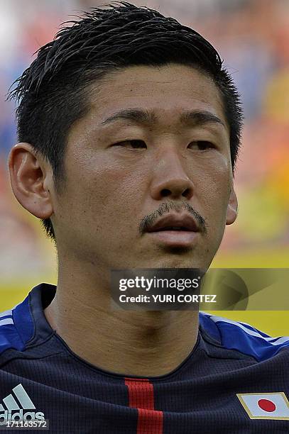 Japan's defender Yuzo Kurihara listens to the national anthems before the start of the FIFA Confederations Cup Brazil 2013 Group A football match...