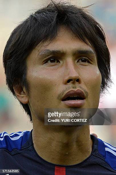 Japan's forward Ryoichi Maeda listens to the national anthems before the start of the FIFA Confederations Cup Brazil 2013 Group A football match...