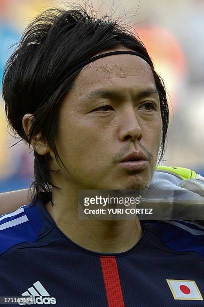 Japan's midfielder Yasuhito Endo listens to the national anthems before the start of the FIFA Confederations Cup Brazil 2013 Group A football match...