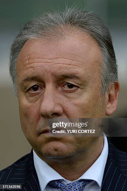 Japan's coach Italian Alberto Zaccheroni listens to the national anthems before the start of the FIFA Confederations Cup Brazil 2013 Group A football...