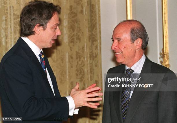 Greek Prime Minister Costas Simitis is welcomed 12 March by British Prime Minister Tony Blair as leaders of the European Union and their counterparts...