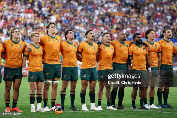 The players of Australia line up during the National Anthems prior to the Rugby World Cup France 2023 match between Australia and Portugal at Stade...