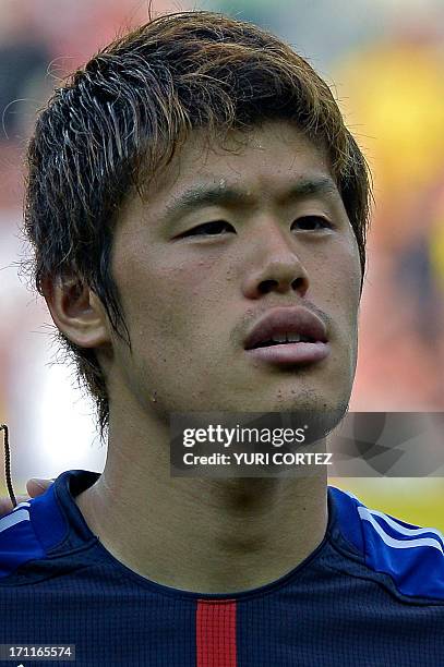 Japan's defender Hiroki Sakai listens to the national anthems before the start of the FIFA Confederations Cup Brazil 2013 Group A football match...