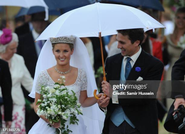 Melissa Percy and Thomas Staubenzee leave Alnwick Castle following their marriage on June 22, 2013 in Alnwick, England.