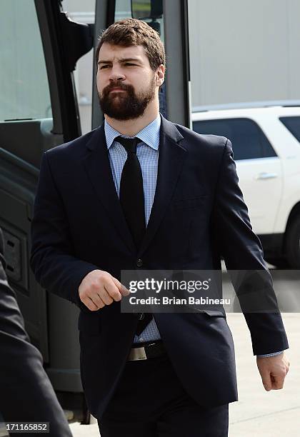 Kaspars Daugavins of the Boston Bruins gets off the bus as he arrives for Game Five of the 2013 Stanley Cup Final against the Chicago Blackhawks at...