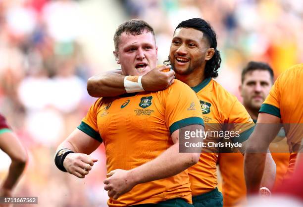 Angus Bell of Australia celebrates with Robert Leota of Australia after scoring his team's third try during the Rugby World Cup France 2023 match...