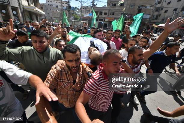 People attend funeral ceremony for a member of Ezz Al-Din Al Qassam Brigades, Fayez al-Asouli died in clashes between Israeli forces and Palestinian...