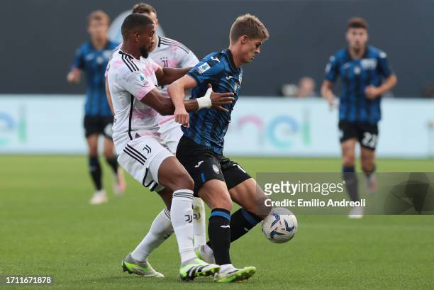 Charles De Ketelaere of Atalanta battles for possession with Bremer of Juventus during the Serie A TIM match between Atalanta BC and Juventus at...